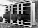 Combined wardrobe with built in table and chair storage